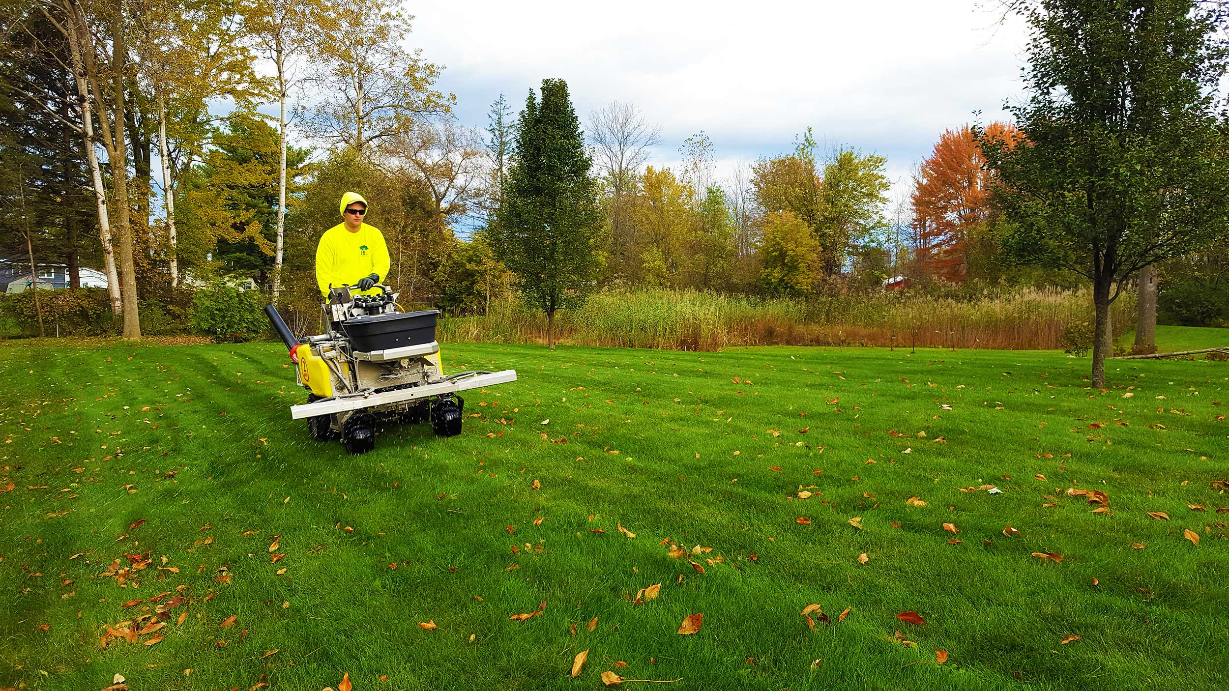 Jim Blackburn applying lawn treatment care